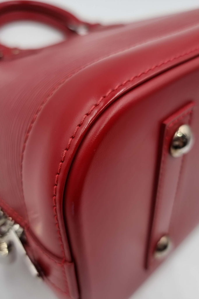 Shop preloved and authentic Alma Epi PM Carmine with Silver Hardware Carmine Bags by Louis Vuitton from Second Edit